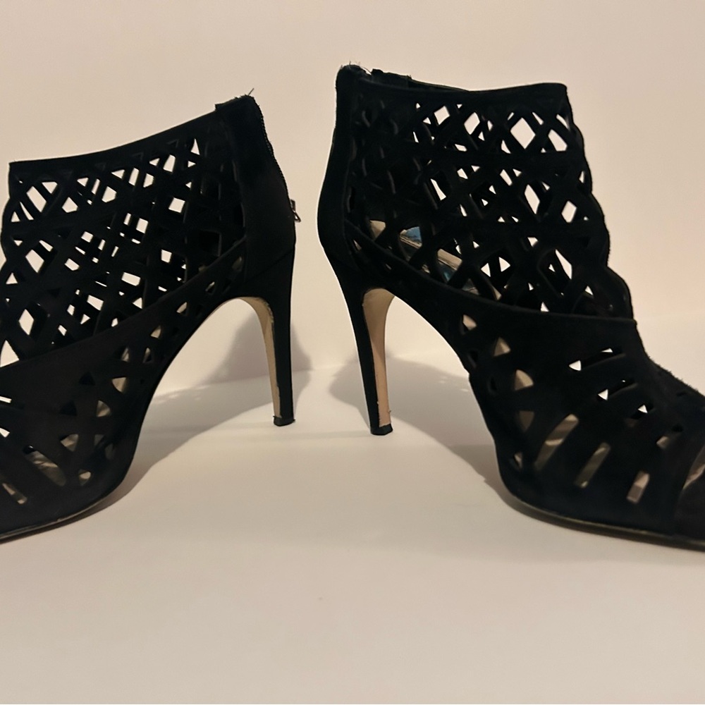 Black Stiletto Heels with Intricate Cut-Out Design